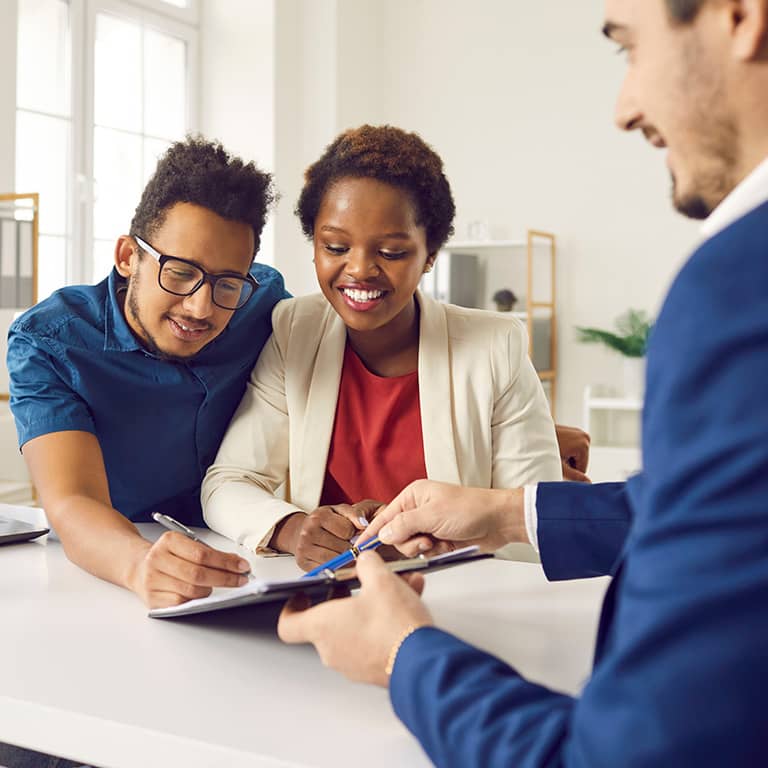 man and woman signing document of business man